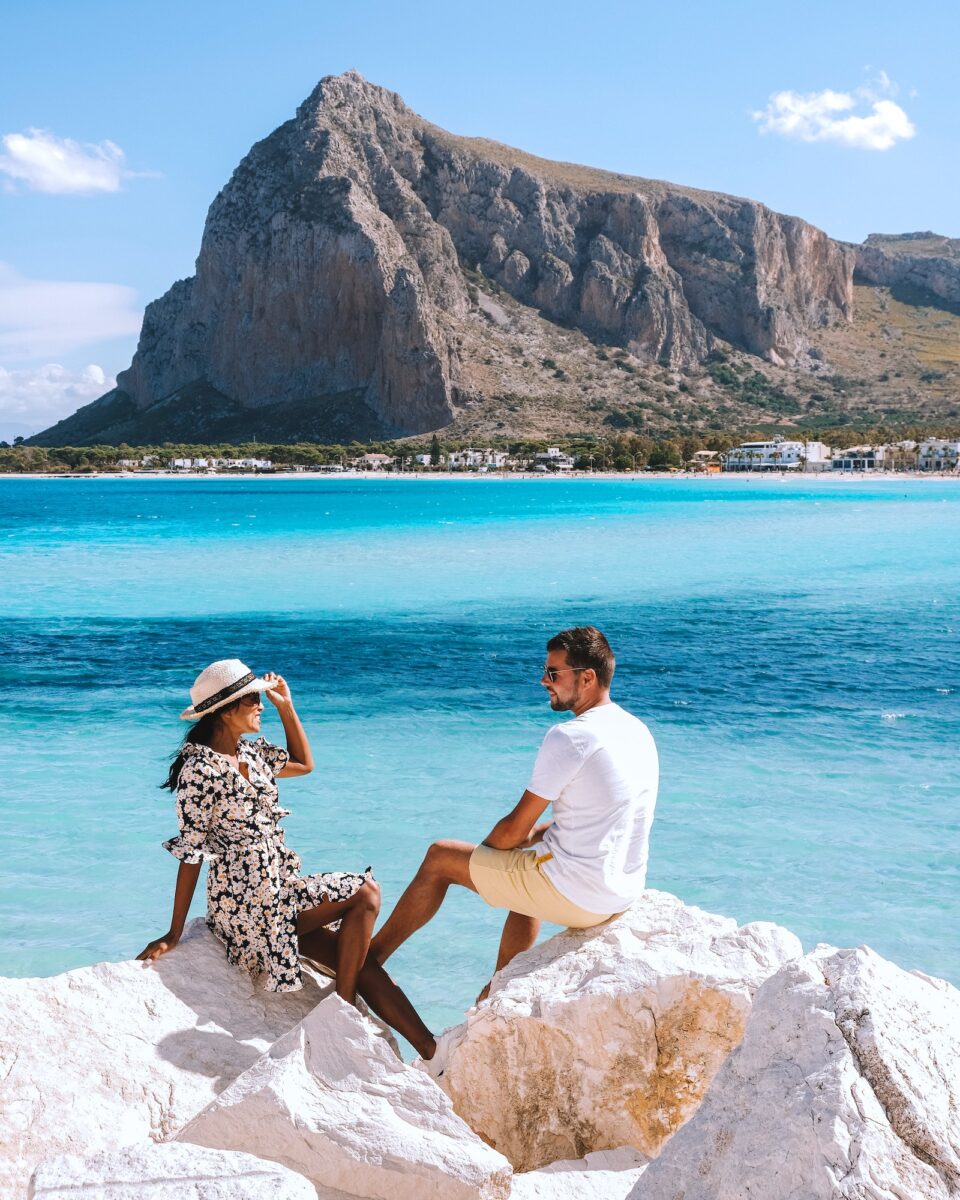San Vito Lo Capo Sicilia, couple men and woman mid age visiting the beach of San Vito Lo Capo Sicily